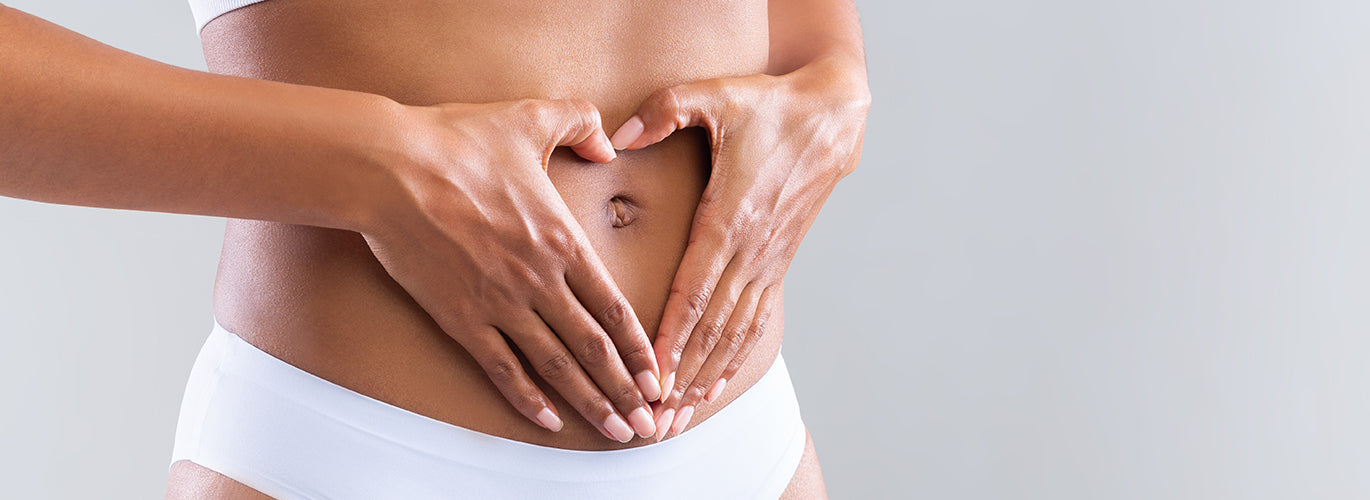 Unerfüllter Kinderwunsch - Hand auf einem Bauch